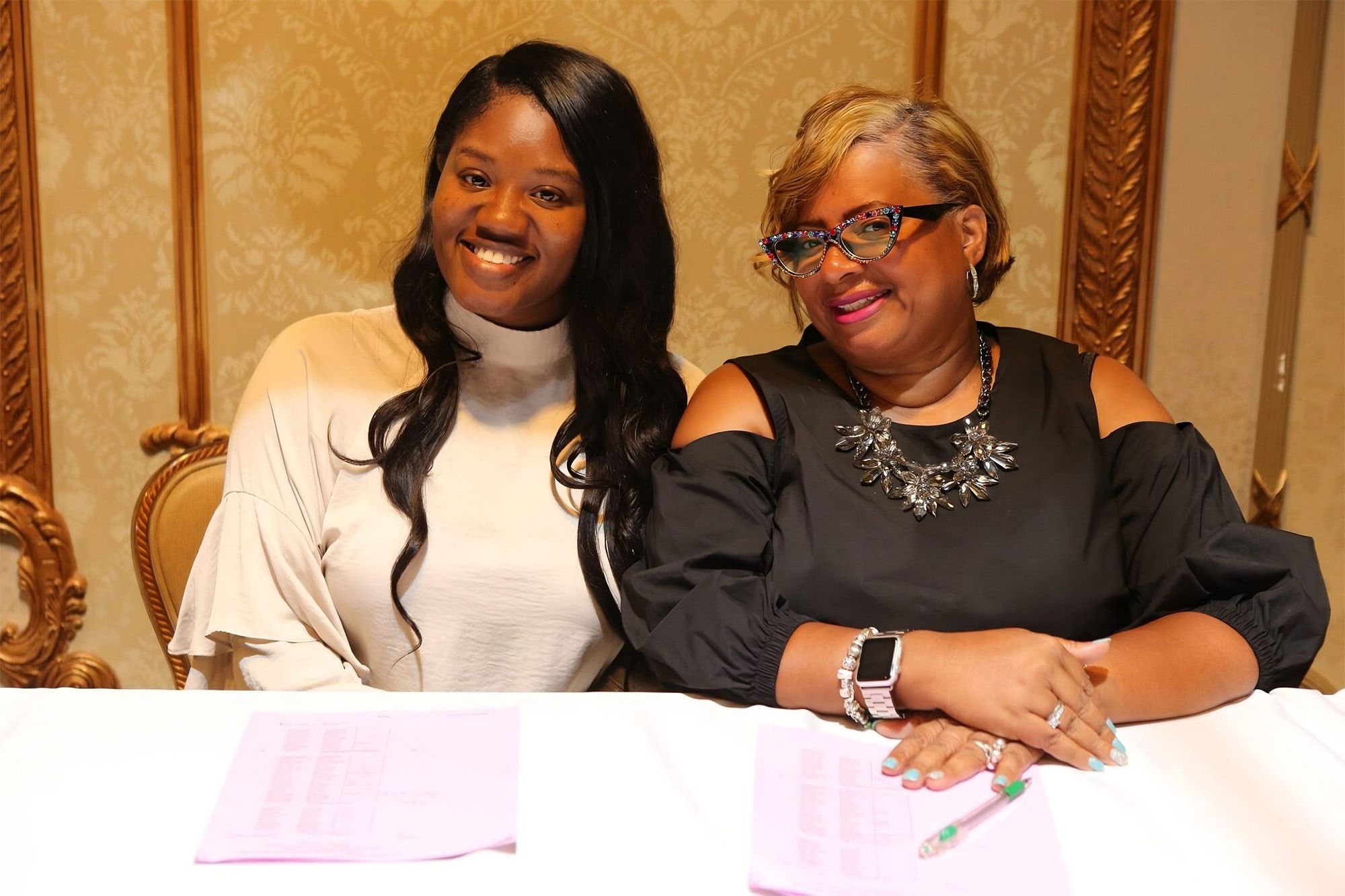 Two women smiling to the camera